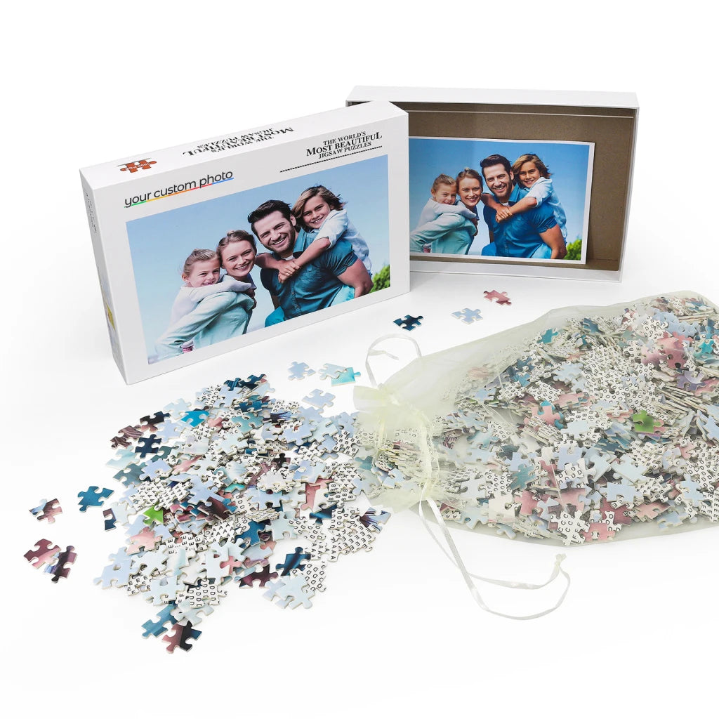 Custom photo puzzle flat lay with thick cardboard pieces and protective storage box
