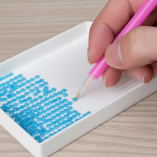 Picking up a drill with the diamond painting pen